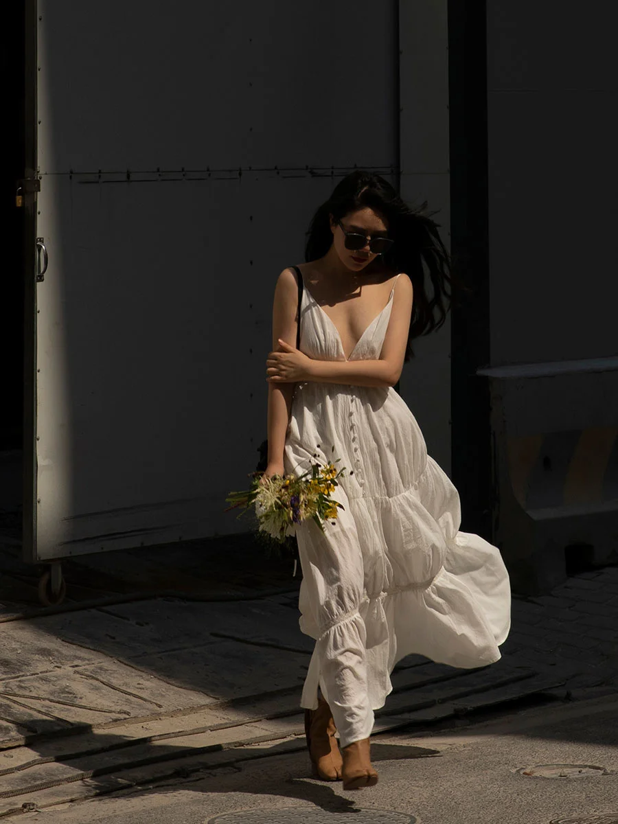 

Holiday-chic white backless dress