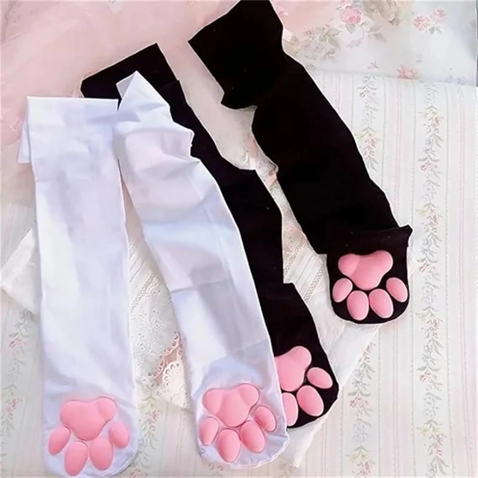 Two pairs of KittyNook Cat Co. 3D Cat Paw Meat Pad Socks with pink toe beans—perfect for kawaii silicone style!.