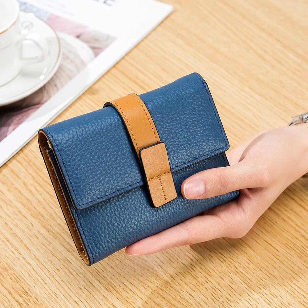 The new leather ultra-thin niche creative design head layer cowhide wallet contracted joker long put mobile wallet