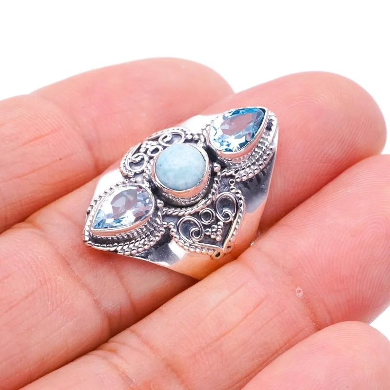 

StarGems®Кольцо из серебра 7,75 F0684 с натуральным голубым топазом