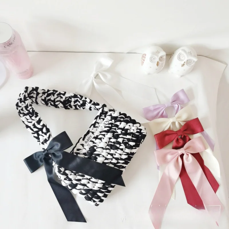 

Famous designer versatile simple cloth strip hand-woven bag crochet hollow bag hand bag women's shoulder bag mobile phone bag