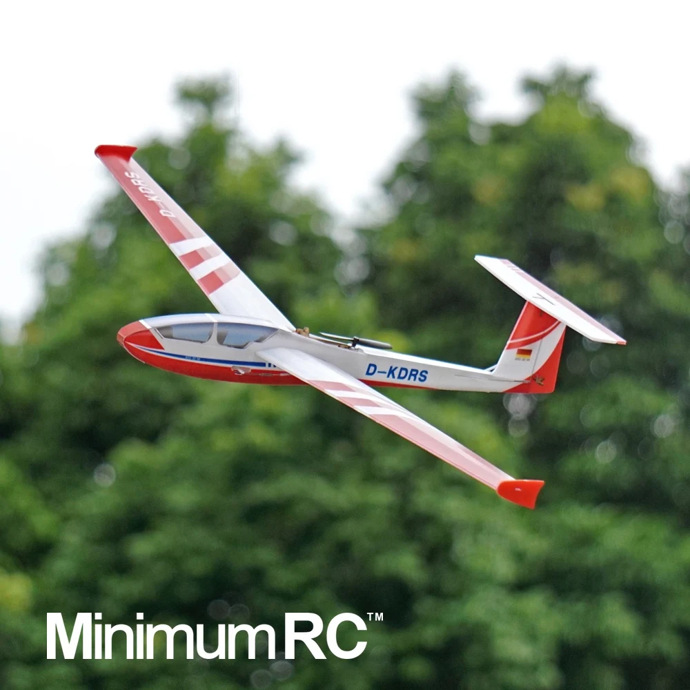 Profil du planeur RC ASG32 560mm, montrant son fuselage fin et sa queue en V, parfait pour débutant.