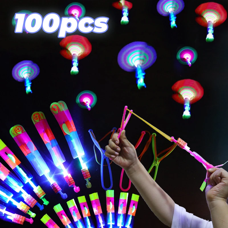 Flying Toy 1/3/5/10/20/50/100pcs Light Toy Arrow Rocket Helicopter Flying Toy LED Light Toys Party Fun Gift Rubber Band Catapult