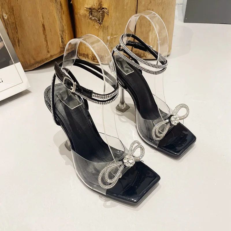 

2023 Rhinestone Bowknot Women Sandals Transparent High Heels Summer Sexy Square Toe Ankle Buckle Strap Shoes Stiletto