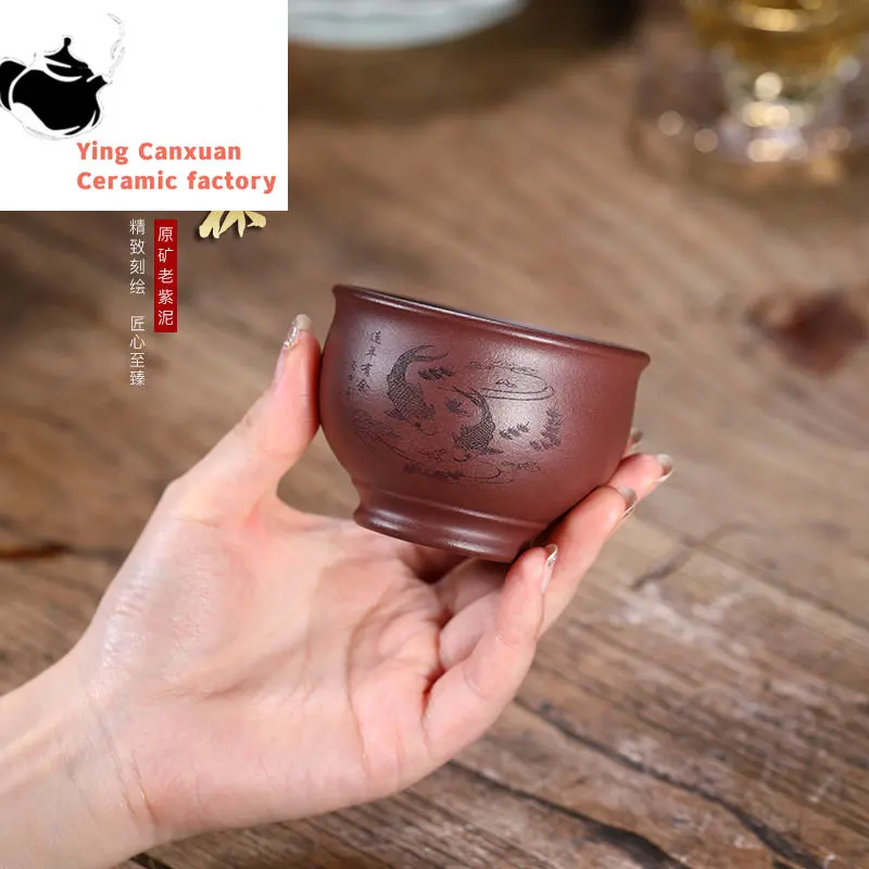 

Yixing purple sand cup raw ore purple mud fish play cup pure hand-carved capacity 120ml
