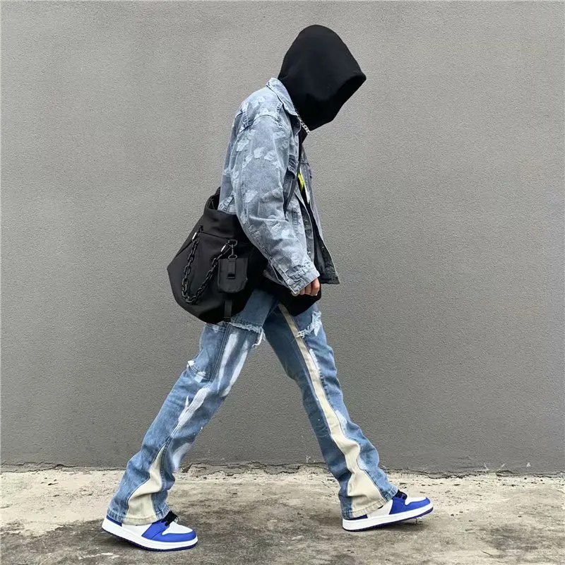 Stylish men's fashion ensemble with blue baggy flare jeans, oversized zip hoodie, and big watches for everyday streetwear2