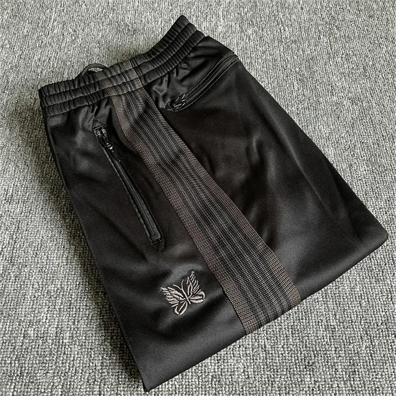 

NEEDLES tide good quality Butterfly Embroidery AWGE black sports pants Mens Womens Same Stripe Stripe Webbing Loose Casual Pants