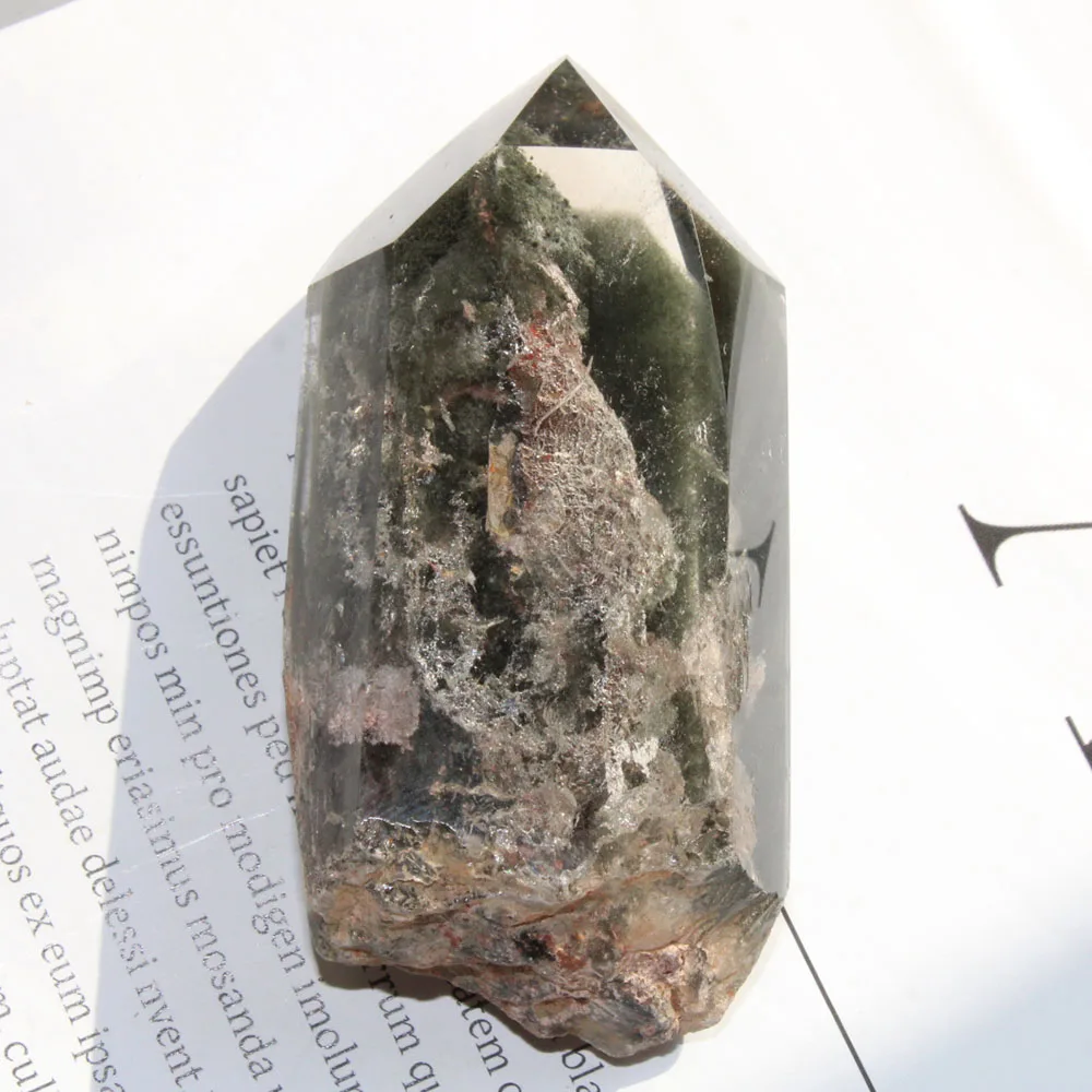 

Hand Carved Natural Green Ghost Phantom Quartz Crystal Column Point With Rough Bottom For Home Decoration