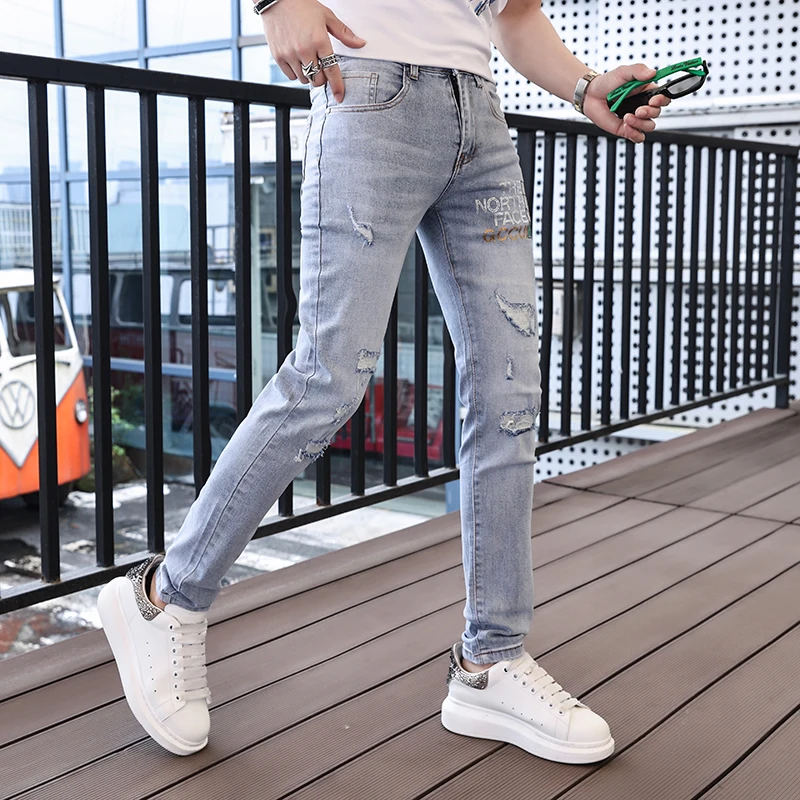 2024 spring and summer new hot drill hole men's jeans printed trend elastic Slim small leg pants high-end versatile men's pants