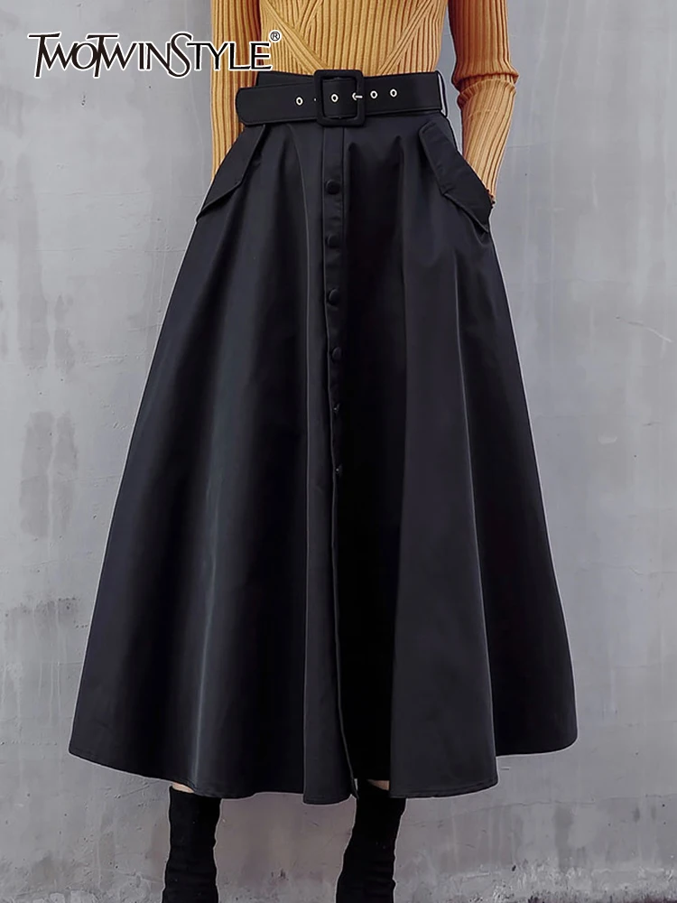 

TWOTWINSTYLE Solid Patchwork Belt Elegant Skirts For Women High Waist Loose Temperament Skirt Female Fashion Clothing 2023 New