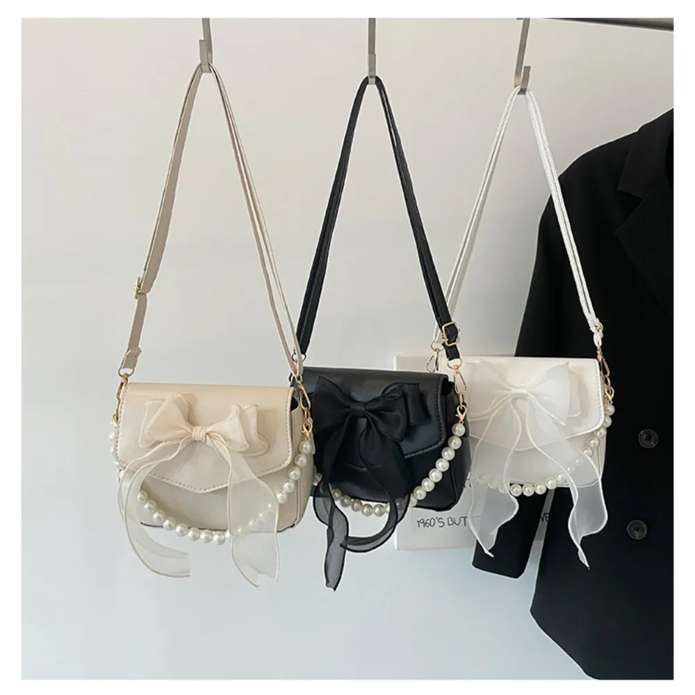 Schwarze Damen-Schultertasche im koreanischen Stil mit Schleife, Henkeltasche aus Canvas, große Achseltasche, Designer-Neuheit 2024_voghion.com