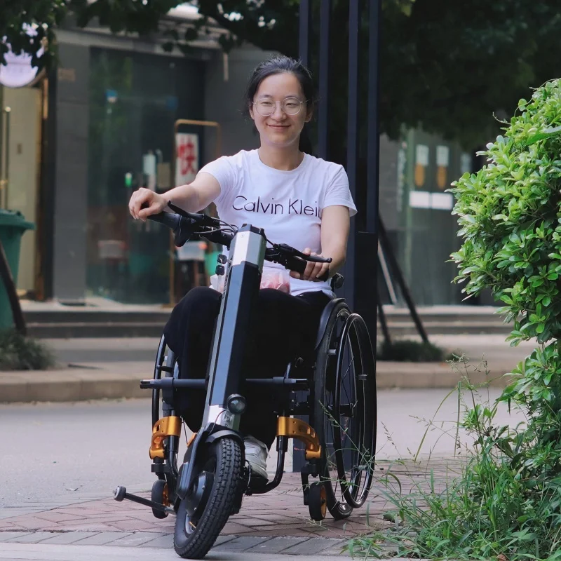 https://ae01.alicdn.com/kf/S773893dce1f84527b0345427f66aca34h/power-assist-wheelchair-attachment-wheelchair-accessories-power-trike-wheelchair-attachment.jpg