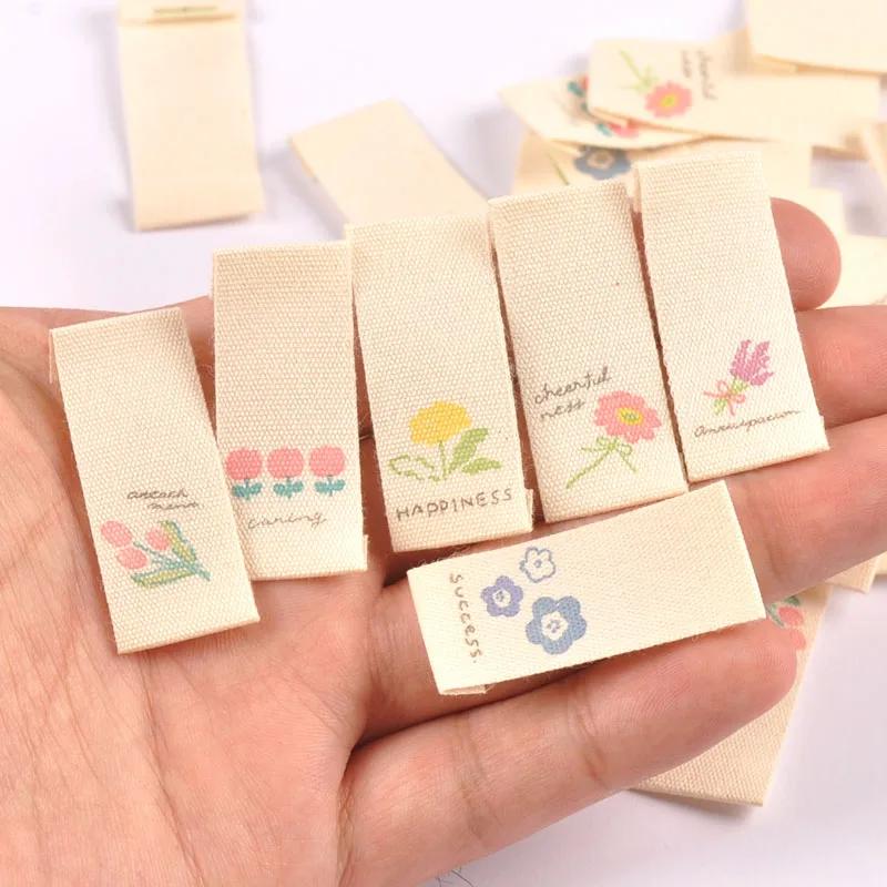 Description Picture 5 of item50pcs 16*38mm Mixed Flower Pattern Handmade Cotton Woven Label For Clothing Labels Cartoon Shoes Bags Garment Tags