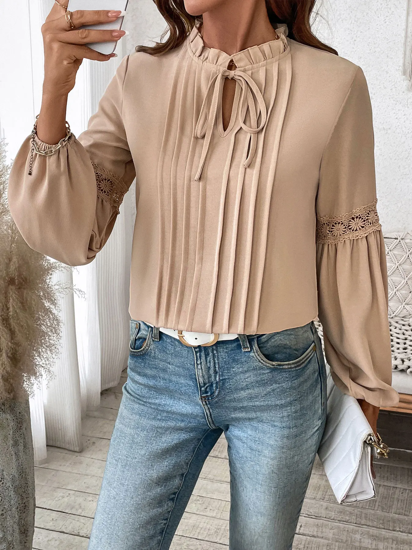 Front view of Marley khaki blouse with tie-neck ruffle