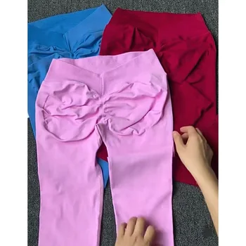 Collant sportivi da corsa per fitness color pesca, sollevamento fianchi senza cuciture, leggings elastici per yoga a vita alta, controllo della pancia, pantaloni color pesca