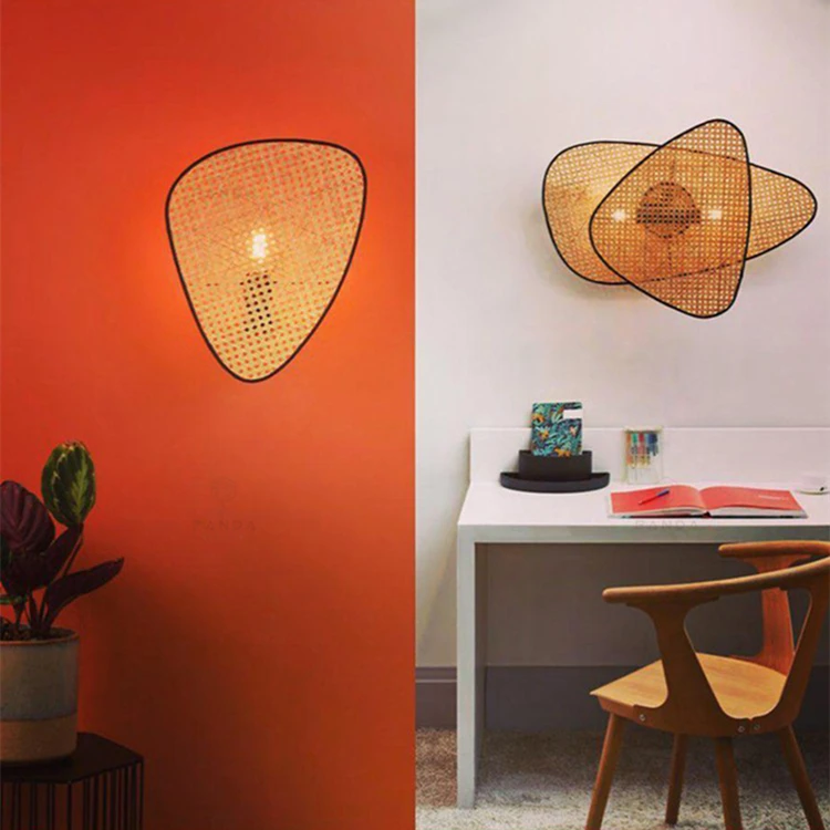 Two modern pictures of a desk with a rattan lamp on it.