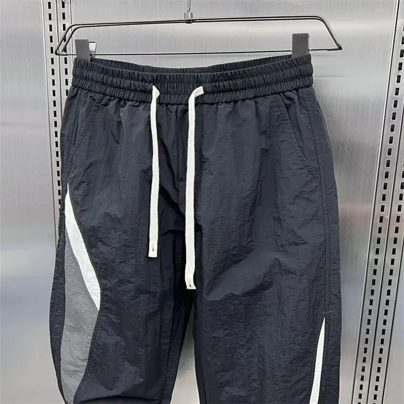 Description Picture 5 of item2024 New Summer Fashion Trendy Men's Casual Sports Style Thin Quick Drying Striped Patchwork Loose and Versatile Harlan Pants