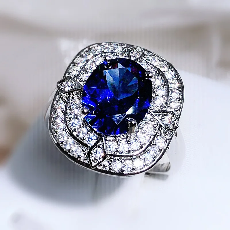 Anillo De Plata 925 Para Mujer Con Circonita Azul - Ancho, Moderno, Con 8 Circonitas Blancas, Rodiado (MATERIA By Matthias Wagner)