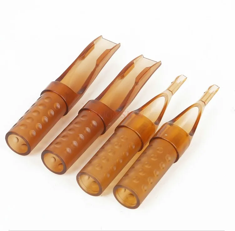 Single use sealing diamond shaped tattoo needle cap with a tattoo needle tip