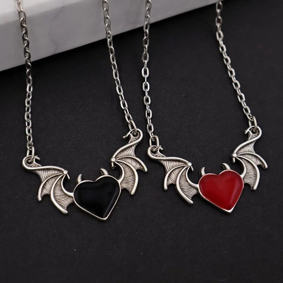 

Choice Aliexpress new Creative Vintage Red Black Heart Pendant Devil Necklace Alloy Angel Wings Jewelry Global Wholesale Price