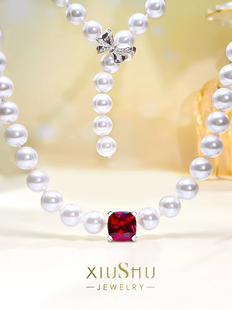 

Fashionable and Luxury Temperament Pearl Beimu Red Treasure 925 Silver Necklace High Carbon Diamond Bow Knot Versatile
