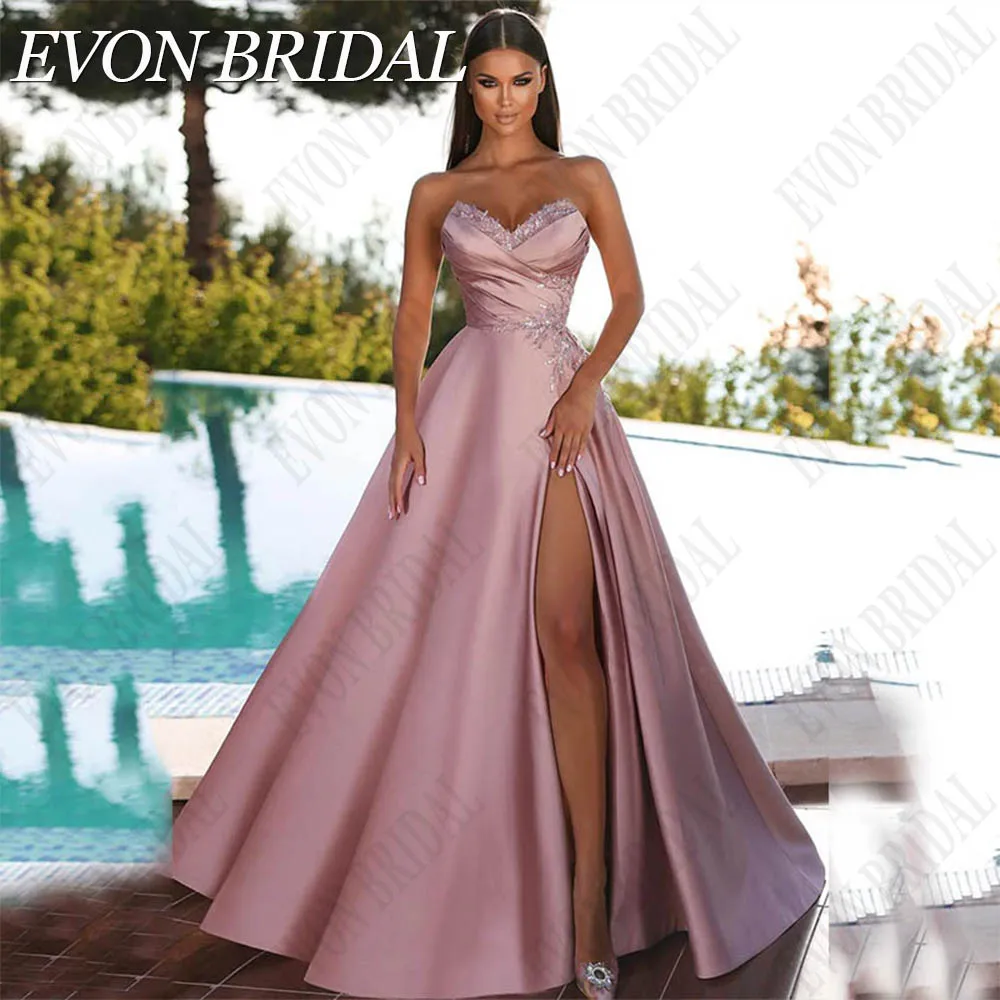 EVON BRIDAL 우아한 민소매 스플릿 무도회 원피스 핑크 새틴 A 라인 파티, 이브닝 V 넥, 격식있는 긴 럭셔리 바닥 길이 핑크 슬릿이 돋보이는 우아한 슬리브리스 무도회 드레스  브이넥 라인의 새틴 A라인 이브닝 드레스  포멀한 롱 럭셔리 플로어 길이 드레스 