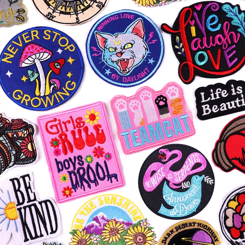 Iron-on patches with cats, feminist slogans, flowers, mushrooms, and rainbow quote designs