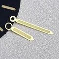 Two gold needles