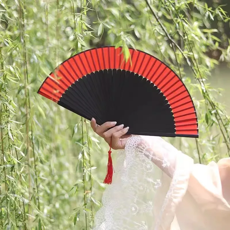 

Folding fan female Chinese style;s folding fan dance Hanfu cheongsam catwalk folding fan performance is easy to open and close.