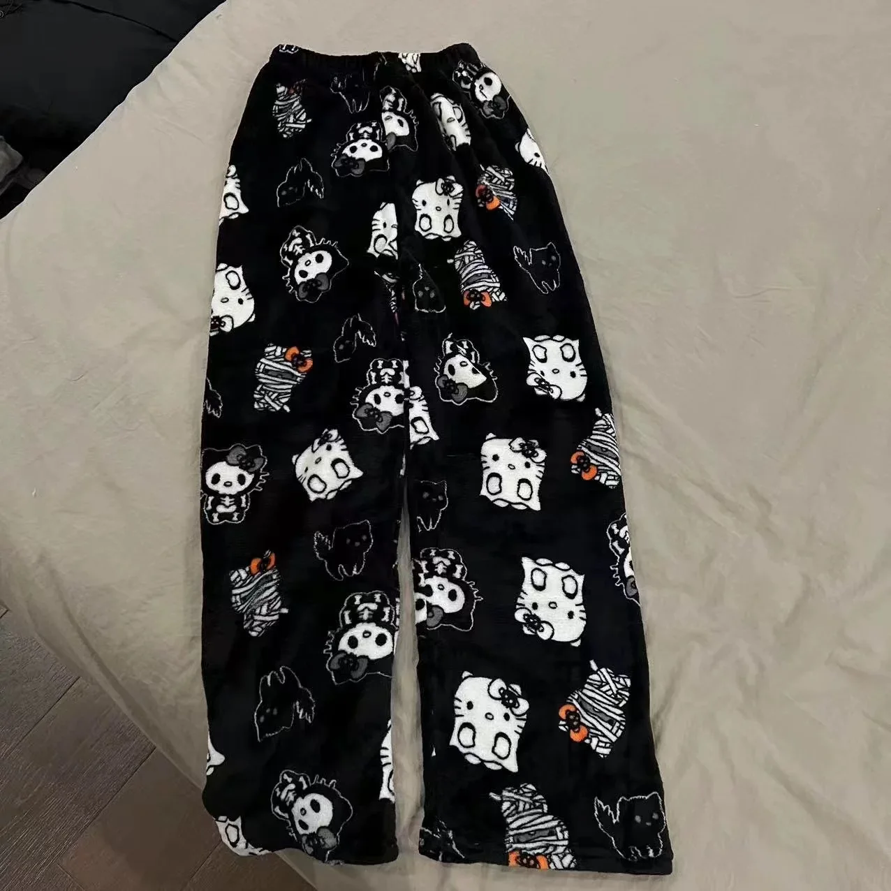 Christmas Hello Kitty pajama pants, loose anime-style loungewear trousers for women, cute cartoon couple sleepwear from CyberStreetOne.com black