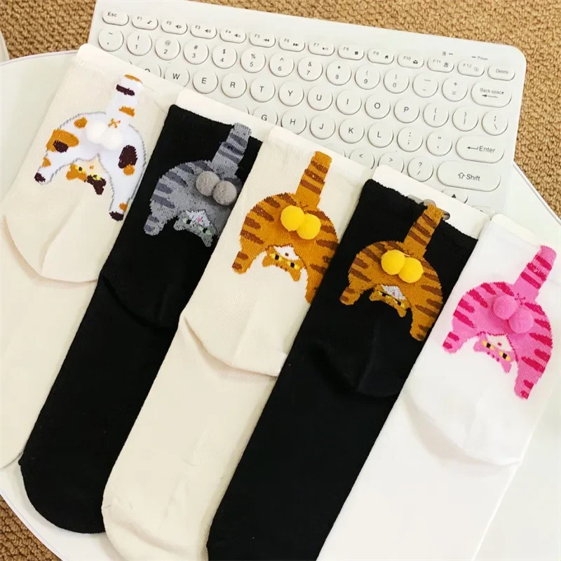 Cartoon cat socks laid out to show color options