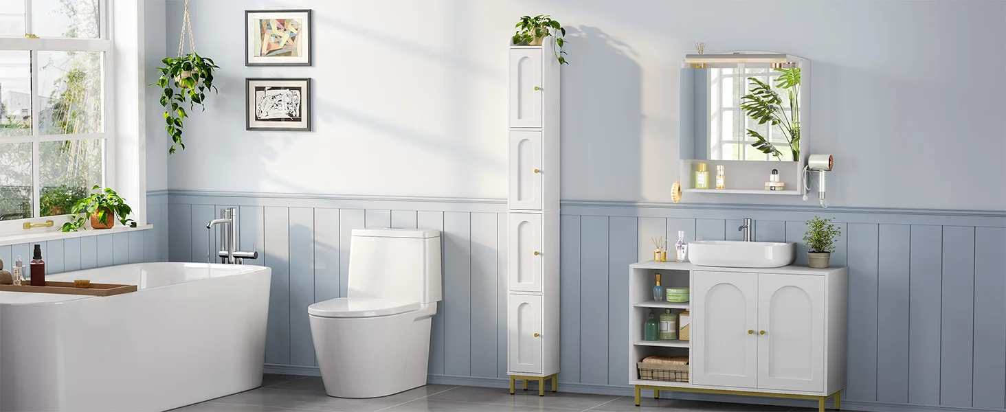 Modern bathroom interior with white tiles, wainscoting, toilet, and vanity. Features framed artwork on walls and decorative plants adding greenery to the space.