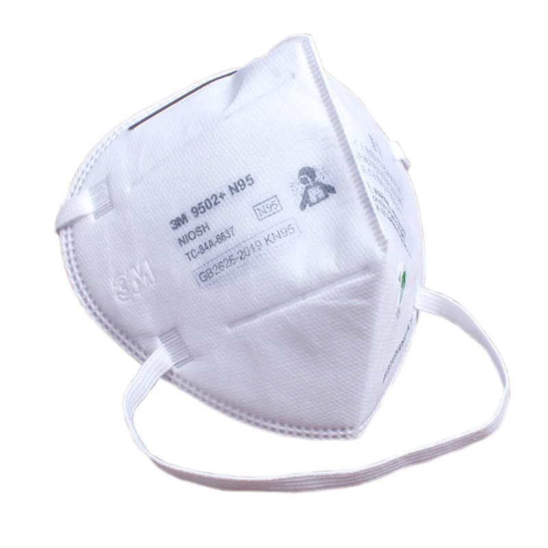 Masque KN95 réutilisable plié, montrant les couches de filtration.