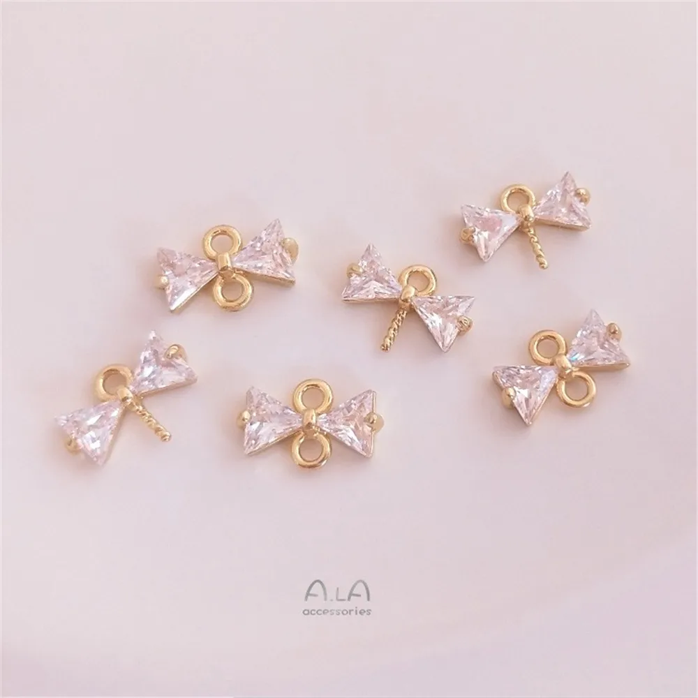 Рисунок 2 - Инкрустированный Цирконом бант из 14-каратного золота