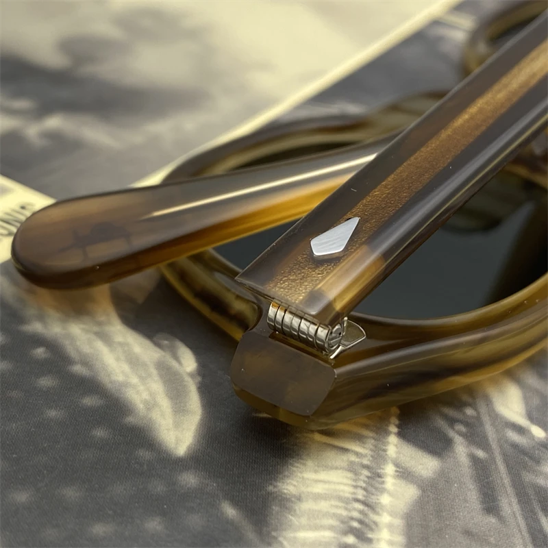 Circular polarized sunglasses showing hinge and temple detail.