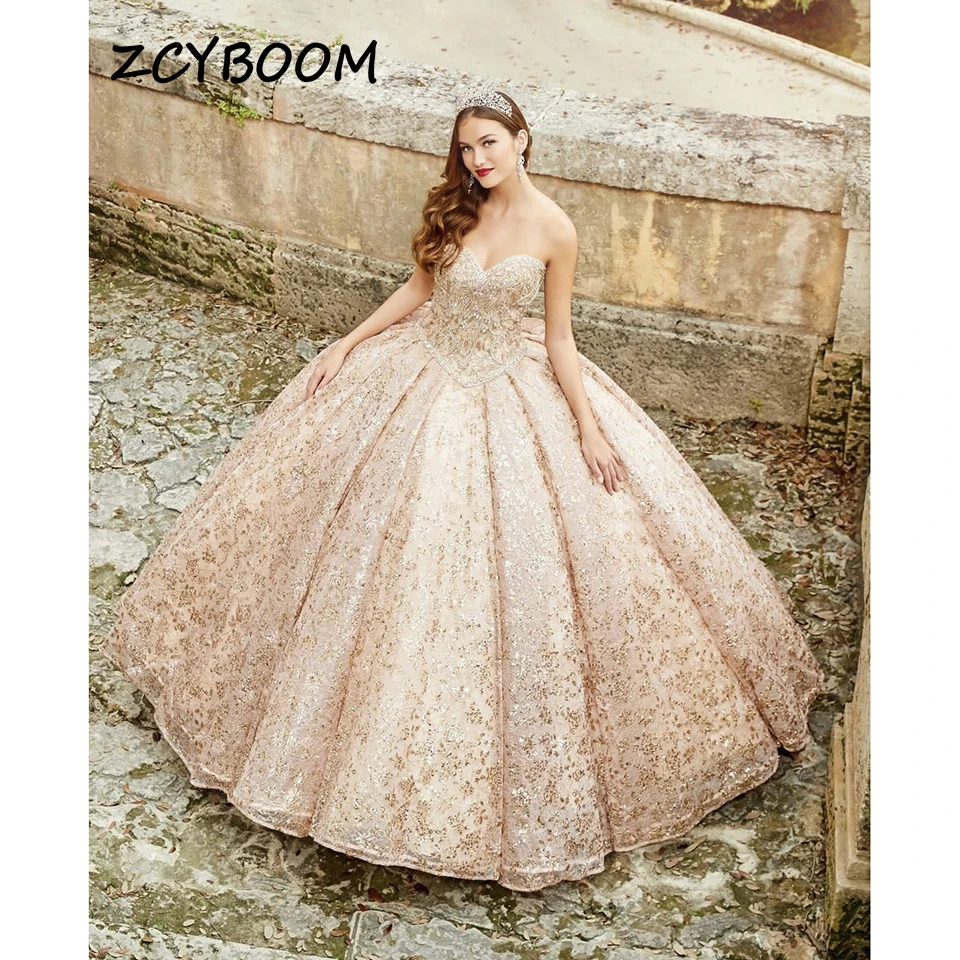 Luxury Strapless Sequin Beaded Bow Evening Dresses 2023 Ball Gown Floor Length Sweep Train Tulle Lace Up Quinceanera Dresses