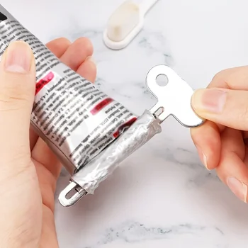 Spremi dentifricio in acciaio inossidabile, spremiagrumi per capelli, vernice ad olio, dispenser rotante per unguenti, cosmetici, accessori da bagno 1