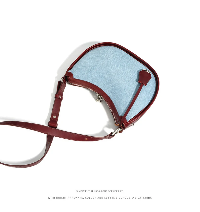 Half moon shoulder bag made of denim with genuine leather trim – casual and stylish design for daily use.