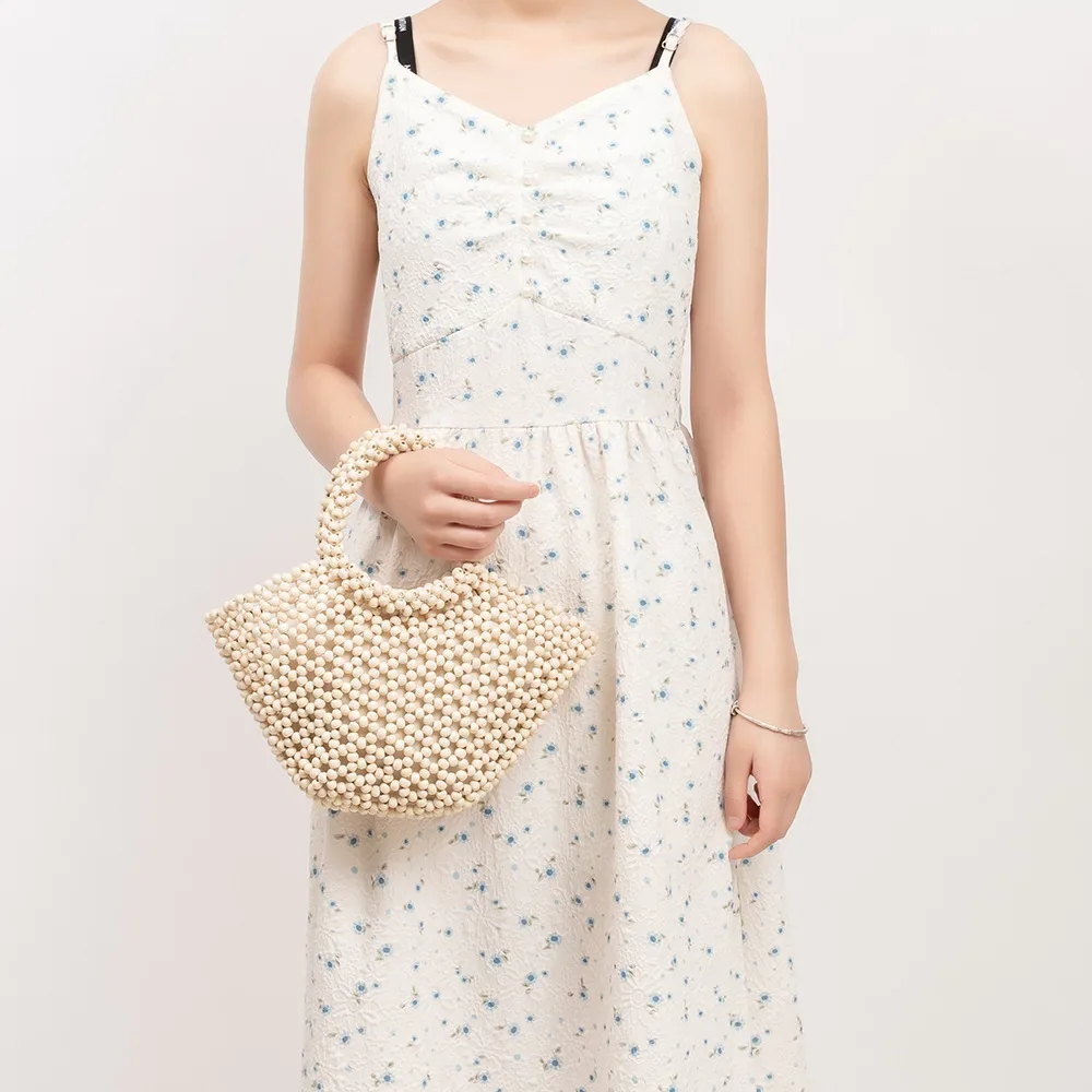Women's Woven bag new hollow out bucket bag summer design commuter wood bead totes bag bohemian travel beach handbag Clutch bags