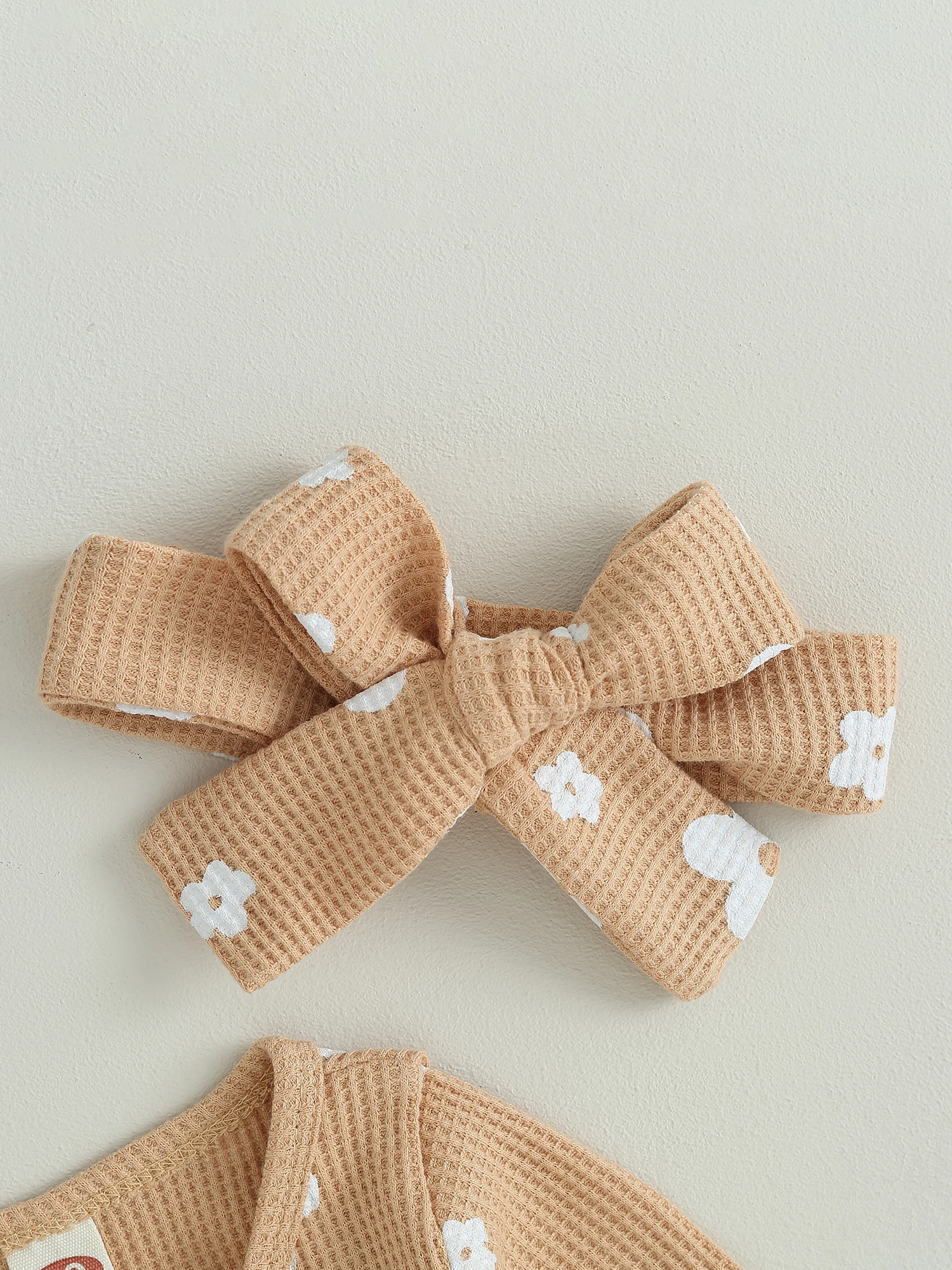 

Cute Toddler Girl Floral Print Footed Romper with Front Zipper Closure and Matching Bow Headband