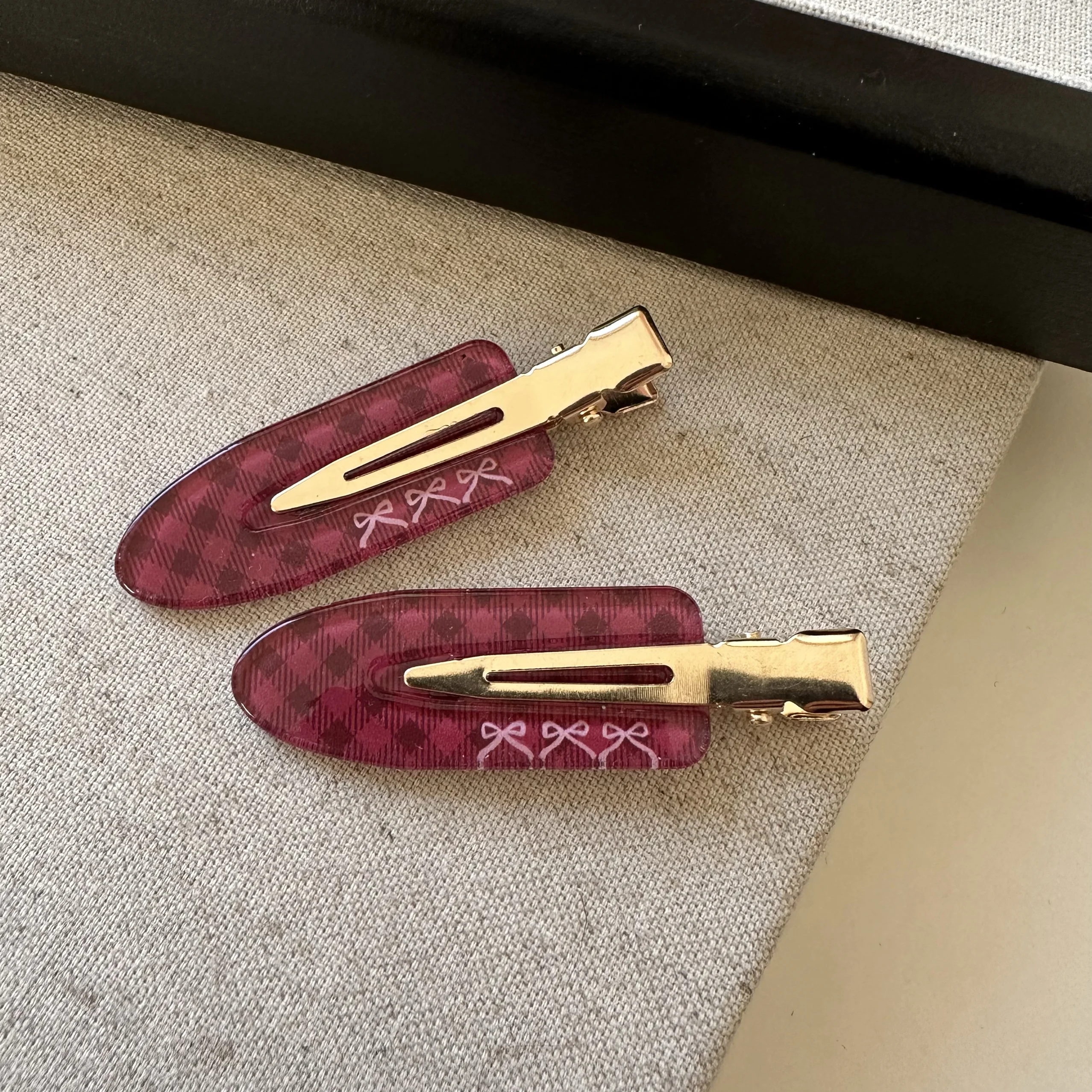 A pair of black and red small plaid