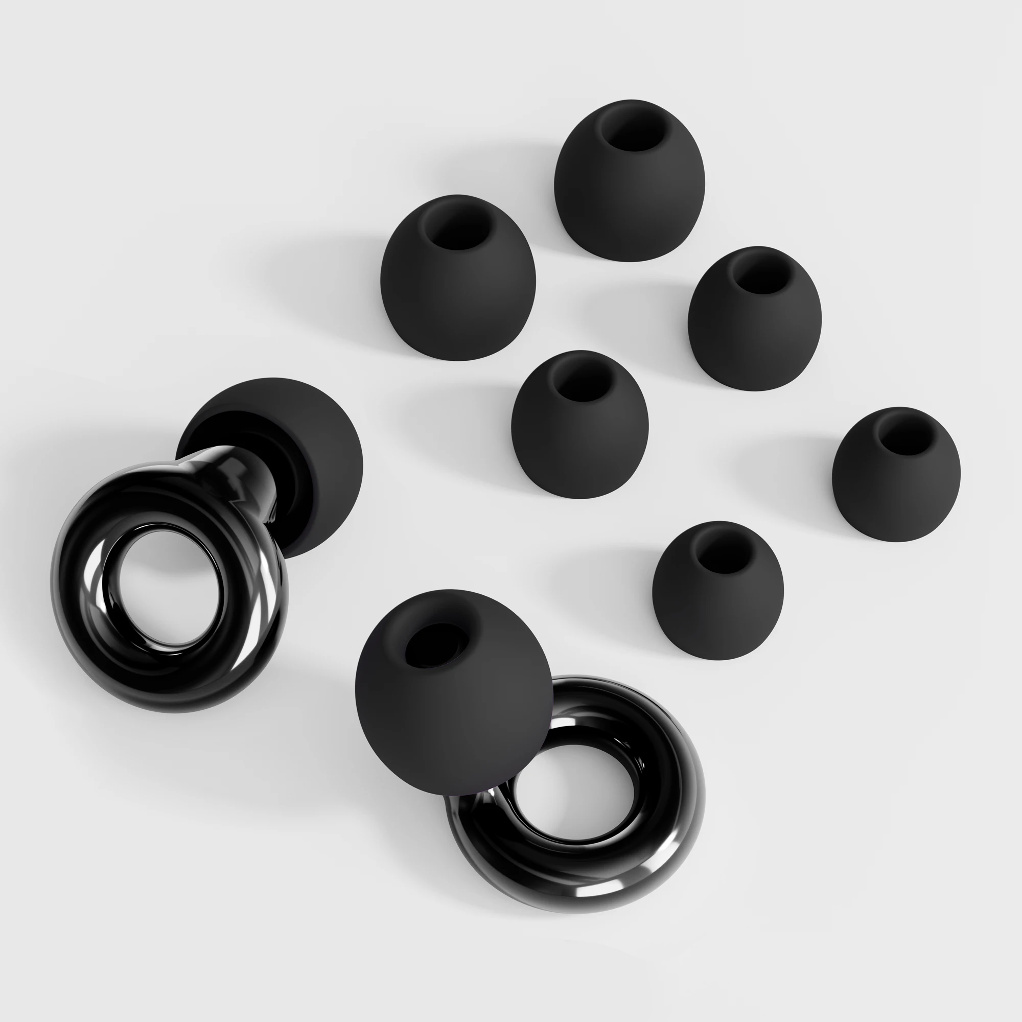Gros plan sur un bouchon d'oreille en silicone souple, montrant sa forme ergonomique, idéal pour protection auditive.
