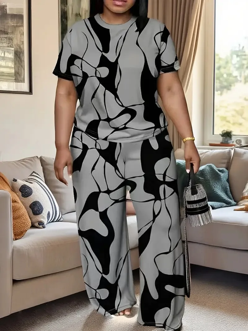 Women's summer fashion print two-piece outfit with round-neck short sleeve T-shirt and wide-leg trousers in a relaxed fit. 01