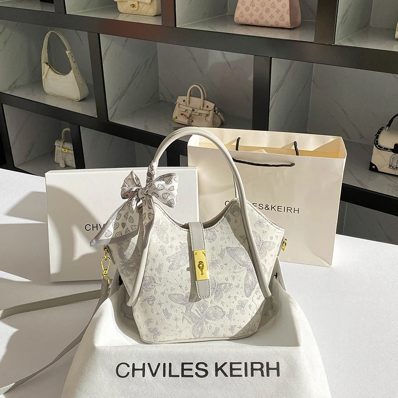 حقيبة حمل جلدية محمولة للنساء، تتميز بطباعة زهور ر...