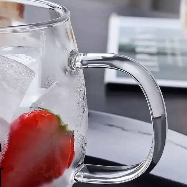 Upgrade your morning routine with the Creative heat-resistant glass with handle breakfast cup.