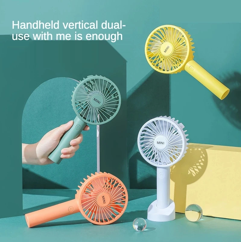 

Portable mini fan Students hold a small fan desktop and hold a USB small fan
