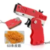 1PC Mini Keychain Gun Rubber Band Gun Toy Gun Shooting Pistol Alloy Kid Outdoor Activities Party Game Birthday Gift for Children 4