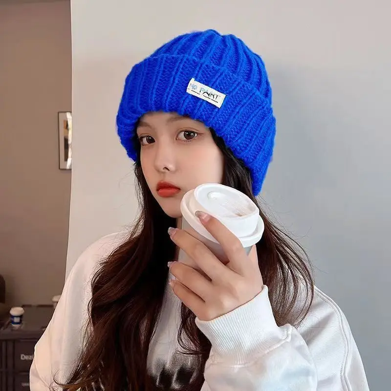 Jednolity kolor jesienne zimowe czapki damskie wełniane ciepła czapka typu Beanie z dzianiny damskie szydełkowe ochrona słuchu czapka