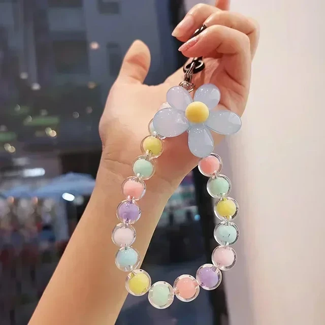 pulseira de celular e chaveiro com cores de macaron