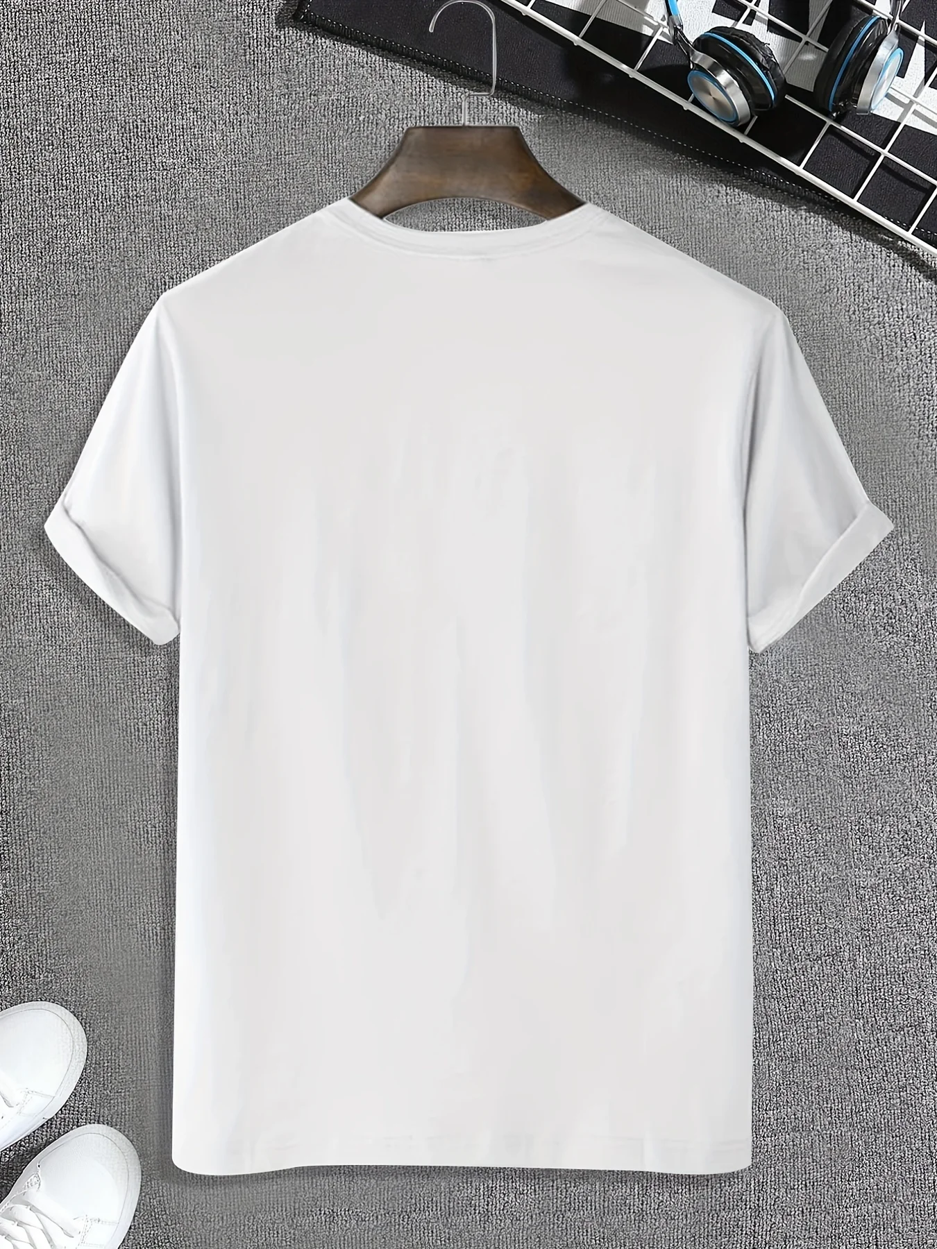 Back view of men’s white Cosmic Voyager astronaut graphic tee